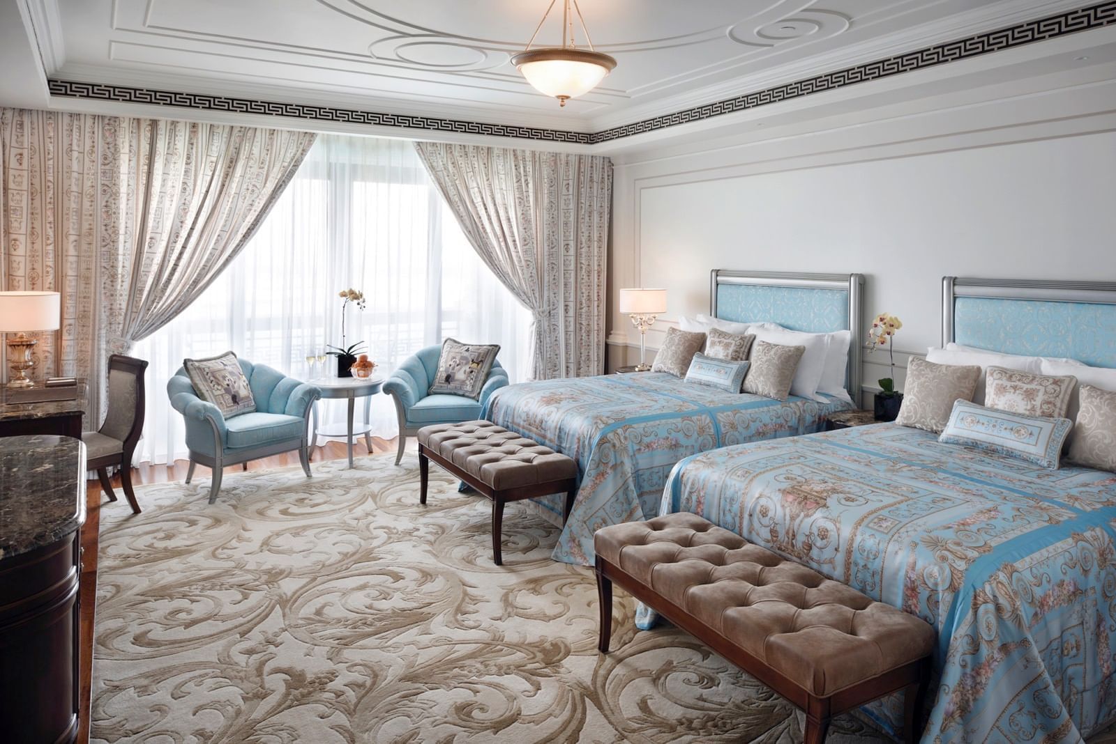 TWIN BEDS IN DELUXE ROOM WITH SOFAS AT PALAZZO VERSACE DUBAI